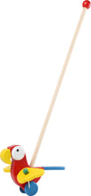 Drevený papagáj s paličkou na tlačenie